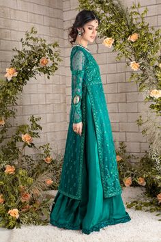 Emerald hued net front-open heavily embroidered jacket featuring glistening sequins, beads, pearls, crystals, stones and silk thread embroidery, attached to pure raw silk pleated gown, paired with heavily sequins embellished net dupatta, a wardrobe must have this wedding season. Gown Fabric: Net & Pure Raw Silk Length: Jacket length 48”, Gown Length 58” (customisable mention in order notes) Dupatta Fabric: Net Color: Emerald Green This is a two-piece outfit including gown & Draped dupatta. All o Festive Set With Sheer Dupatta And Front Open Design, Semi-stitched Front Open Anarkali Set With Dupatta, Anarkali Dupatta With Resham Embroidery And Front Open, Anarkali Dupatta With Resham Embroidery, Designer Semi-stitched Front Open Anarkali Set, Elegant Front Open Anarkali Set In Georgette, Front Open Georgette Anarkali Set With Zari Work, Designer Wear Front Open Salwar Kameez With Zari Work, Designer Resham Embroidered Front-open Anarkali Set