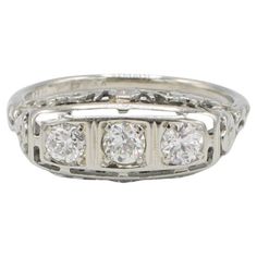 Art Deco 18 Karat White Gold Old European Cut Natural Diamond Three-Stone Ring  Metal: 18k white gold Weight: 3.17 grams Diamonds: 3 old European cut natural diamonds .40 CTW F-G VS Size: 6.5 (US) Height: 4.7mm Width: 7.3mm Diamond Three Stone Ring, Three Stone Ring, Baltimore Md, Art Deco Diamond, Ring Metal, Three Stone Rings, Three Stone, Stone Ring, Metal Rings