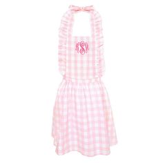 a pink and white gingham dress with the monogrammed initials on it