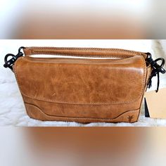 Grained Finish, Detachable Top Carry Handle, Adjustable Detachable Shoulder Strap, Brand Logo Embossed, Stitch Trim, Convertible Style 10in W X 6in H Magnetic Disc Closures 1 Interior Zip Pocket Leather New With Tags! Frye Bags, Leather Satchel, Beige Color, Brand Logo, Convertible, Zip Pockets, Satchel, Shoulder Strap, Bag Lady