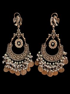 These oxidized earrings come in two beautiful colors with an antique gold finish to complete the royal look. They are very comfortable to wear and the colors are subtle with antique gold work to not overpower the look of the statement earrings. Brass Chandbali Danglers With Matching Earrings, Brass Chandbali Danglers, Temple Jewelry Bridal Chandbali Earrings In Brass, Temple Jewelry Chandbali Bridal Earrings In Brass, Festive Brass Chandbali Earrings, Brass Chandbali Danglers With Intricate Design, Festive Brass Chandbalis With Matching Earrings, Festive Bohemian Dual-tone Earrings, Brass Chandbali Jhumkas With Intricate Design