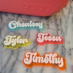 "Gear up for summer or your tropical getaway with this two toned personalized Bogg Bag Monogram in our fun trendy font. Choose from a variety of background colors and then top it with solid white or black.  Each layer is 1/8\" acrylic. The bogg button on the back is 3D printed in PLA and attached with E6000.  Do not pull to remove from the front. Push the charm out from the back.  Acrylic can break if it hits a hard surface with enough force." Bogg Bag Aesthetic, Bogg Bag Tassel, Bogg Bag Charms, Bogg Bag Accessories, 5th Grade Graduation, Glowforge Projects, Trendy Fonts, Pool Bag, Baseball Bag