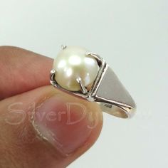 Important : PLEASE ENTER YOUR PHONE NUMBER IN THE "NOTE TO SELLER" SECTION DURING CHECKOUT, SO THAT THE DELIVERY CAN BE HASSLE FREE.Stone : PearlMetal : 925 Sterling SilverStone Size : 8mm ( Can be customized as per your need)Shape : RoundBand Size : 2mmShips worldwide from India925 stampedHandmade ItemSTYLE STATEMENTBe it ethnic or casual wear, this ring is sure to add style to your look. Match it with any attire and stay trending at all times.CUSTOMIZATIONWe welcome customization.Change in gem Silver Sterling Silver Pearl Ring With Polished Finish, Sterling Silver Open Pearl Ring With Polished Finish, Sterling Silver Pearl Ring With Polished Finish, Sterling Silver Pearl Ring With Polished Finish For Anniversary, Wedding Pearl Ring Stamped 925 In Sterling Silver, Wedding Pearl Ring In Sterling Silver, Silver Sterling Silver Pearl Ring, Sterling Silver Open Pearl Ring Fine Jewelry, Sterling Silver Open Pearl Ring