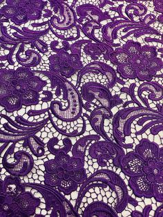 an image of purple lace with flowers on it