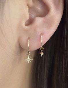 14k Gold Star Shaped Pierced Jewelry, Yellow Gold Huggie With Star Charm, Gold Celestial Dangle Huggie Earrings, Hypoallergenic 14k Gold Star Jewelry, Gold Hoop Huggie Earrings With Star Charm, Gold Star Huggie Earrings In Celestial Style, Gold Star Shaped Huggie Earrings, Gold Star-shaped Celestial Huggie Earrings, Gold Star Celestial Huggie Earrings