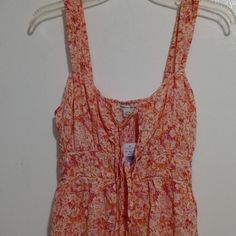 Brand: American Eagle Outfitters Color: Multicolor Floral Print (Orange, Pink, White Colors) Size: S Material: Shell: 100% Viscose Fabriqu: Made In India Care: Machine Wash Cold This Is A Beautiful Multicolor Lining Sun Dress With Sleeveless With Elastic Straps, Fit And Flare, Open Front Henley Neck With Spaghetti Straps For Closure, An Elastic Band On The Rear Waistline, Have A Side Pocket, And A Ruffle On Bottom Hem. From The Shoulder To The Bottom Hem Is 31 Inches In Length. Please Feel Free Pink Sleeveless Sundress For The Beach, Pink Sleeveless Sundress, Orange Sundress For Spring And Summer, Pink Sleeveless Sundress For Spring, Peach Sundress For Spring, Orange Sleeveless Sundress For Spring, Sleeveless Orange Dress For Spring, Orange Sundress For Spring, Orange Sleeveless Spring Dresses