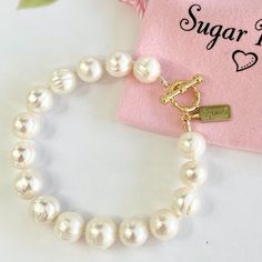 Chunky White Freshwater Pearl Bracelet - Handmade - White Chunky Freshwater Pearls - 14k Gold Filled Toggle And Findings, Sugar Pearls Tag Is 14k Gold Plated - Hand Knotted On White Silk - Bracelet Diameter Is 6-3/8". See Last Photo For Sizing. Matching Necklace And Other Styles And Colors Are Available Non-Smoking, Pet Free Environment Tags & Other Listings: Red Garnet, Iolite, Blue Turquoise, Pink Turquoise, Green Turquoise, Yellow Citrine, Pink Tourmaline, Green Peridot, Quartz, Semi-Precious Hypoallergenic Pearl Bracelet For Anniversary, Elegant White Pearl Bracelet With Lobster Clasp, White Jewelry With Toggle Clasp, White Bracelet With Toggle Clasp As Gift, White Bracelets With Lobster Clasp For Wedding, White Adjustable Bracelets With Toggle Clasp, Adjustable White Bracelets With Toggle Clasp, Elegant Adjustable Bracelet With Toggle Clasp, Single Strand Bracelet For Anniversary