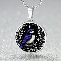 Blue Bird Necklace, featuring an enchanting Bluebird Pendant, can be Engraved to create a unique Spirit Companion, making it a perfect Jewelry Gift For Her, suitable as a Valentines Gift or a cherished Mothers Day Necklace. ➜ Our Blue Bird Jewelry is made of high quality surgical steel with a graphic image that's printed directly onto the steel surface with a shatterproof liquid glass coating and includes an 18k gold finish option. ➜ Our Engraved Bluebird Pendant Necklace are personalized in the Blue Engraved Necklace For Gift, Blue Engraved Round Pendant Necklace, Blue Engraved Jewelry For Gift, Engraved Sapphire Jewelry For Gift, Blue Engraved Pendant Necklace, Personalized Blue Round Pendant Necklace, Necklace With Round Pendant And Bird Design For Gifts, Personalized Blue Round Pendant Jewelry, Bird Design Necklace Perfect For Gifts