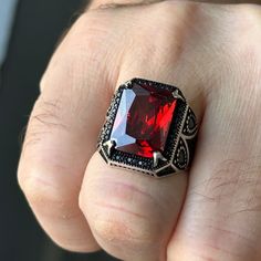 Introducing our exquisite Ruby Silver Men's Ring, featuring a captivating red Garnet stone. Handcrafted with love, this unique piece showcases a stunning Ottoman style design that effortlessly combines tradition and modernity. Made with high-quality 925k sterling silver, this ring exudes a luxurious feel and guarantees exceptional durability. This remarkable masterwork is the perfect gift for that special man in your life, making it an ideal choice for birthdays, anniversaries, or any special oc Collectible Red Engraved Ring, Red Engraved Signet Ring For Formal Occasion, Formal Red Engraved Signet Ring, Red Stone Setting Ring Gift, Collectible Red Ruby Ring With Polished Finish, Red Stone Setting Ring As Gift, Red Stone Setting Ring For Gift, Fine Jewelry Red Ruby Gemstones, Collectible Red Ruby Rings