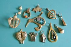 Unique lot of 11 vintage 1960s small goldcolor brass/ metal charms/ pendants of different size/ shape/ age for reuse in jewelry prodjects. Size:   between 0.5 - 1.2 "/ inch or 13 - 30 mm in length with loops. Unique Handmade Gold Charms, Vintage Metal Pendant Charms, Vintage Gold Handmade Charms, Vintage Handmade Gold Charms, Handmade Vintage Gold Charms, Vintage Nickel Free Brass Charms, Vintage Handmade Brass Charms, Handmade Vintage Brass Charms, Vintage Handmade Metal Charms