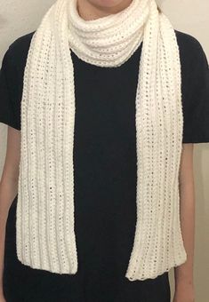 This scarf is made of a soft, acrylic yarn which makes it cozy and easy to care for. It comes in white, black or gray. A matching hat is also available in the shop. Machine washable. Casual Winter Scarves In Wool, Warm Casual Scarf In Acrylic Yarn, Warm Casual Acrylic Yarn Scarf, Cozy White Winter Scarves, Casual Winter Scarf, One Size Fits Most, Casual Acrylic Yarn Scarf, Casual White Scarves, White Knitted Scarf For Fall, Acrylic Yarn Scarf For Cold Weather