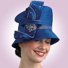 Discover the epitome of elegance with the Lily And Taylor H285 Church Hat, a statement piece designed to elevate your attire for any special occasion. This stunning hat boasts a unique and eye-catching design that merges classic style with a modern twist, ensuring that it stands out in the best possible way. The craftsmanship of the hat is unmatched, assuring not only an appealing look but also longevity and durability. Made from high-quality materials, the hat is constructed to provide a comfor Church Hat, The Crafts, Rhinestone Embellishments, Church Hats, Timeless Pieces, One Size Fits All, Orange Color, Statement Pieces, Bead Work