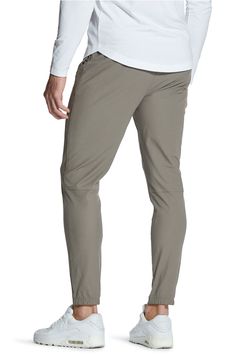 Stretchy, sweat-wicking Versaknit™ fabric keeps you day-to-night comfortable in flat-front pants that take you from desk to drinks to dinner with ease. 28" inseam (size Medium) Zip fly with snap closure Side-seam pockets Moisture-wicking fabric engineered for dryness and comfort 100% polyester Machine wash, tumble dry Imported Sporty 4-way Stretch Pants For Everyday, Relaxed Fit Solid Bottoms In Recycled Polyester, Relaxed Fit Bottoms In Recycled Polyester, Travel Bottoms With Elastic Waistband And Nylon Material, Stretch Activewear For Travel, Stretch Bottoms With Comfort Waistband In Recycled Polyester, Nylon Bottoms With Elastic Waistband And 4-way Stretch, Casual Moisture-wicking Pants With 5-inch Inseam, Functional Fitted Travel Bottoms