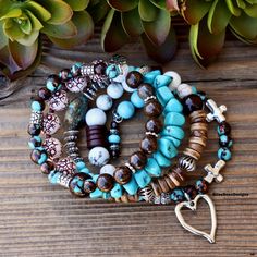 Need a little arm candy?   With an eclectic mix of texture in vibrant blues and earthy browns, this eye catching piece makes an impact with every turn of your wrist. 🤎 Made of memory wire that wraps around your wrist for an instant stack! Add your favorite essential oils to the Lava stone for aromatherapy benefits. *One available* This bracelet consists of: Bronzite    Coconut Shell    Amber Acrylic Floral Beads    Wood Beads  Bronzite Turquoise Blue Turquoise Matte (Magnesite)      Blue Turquo Spiritual Stackable Turquoise Stretch Bracelet, Rustic Adjustable Blue Bracelets, Rustic Blue Adjustable Bracelets, Rustic Turquoise Bracelets For Jewelry Making, Rustic Turquoise Bracelets As Gift, Bohemian Adjustable Turquoise Charm Bracelet, Bohemian Turquoise Adjustable Charm Bracelet, Stackable Bohemian Turquoise Beaded Bracelets, Bohemian Stackable Beaded Bracelets In Turquoise