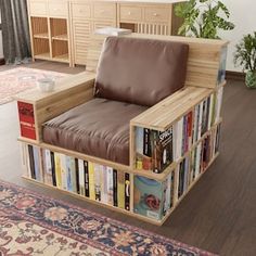 a living room filled with furniture and a book shelf on the floor next to a window