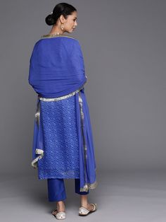 Grab this beautiful 3-piece set. The set comes with bandhani print & embroidered kurta has round neck, 3/4th sleeves & calf length teamed with solid trouser pant with elasticated waistband and a slip-on closure and a silk chiffon dupatta with lace detailing. Color - Blue Kurta Fabric-Cotton Blend Bottom Fabric-Cotton Blend Dupatta Fabric - Silk Chiffon Neck-Round Neck Sleeves-3/4th Sleeves Work - Bandhani Print & Embroidery Detailing Washing Instructions-Hand Wash DISCLAIMER - The color of the p Bandhani Print, Blue Kurta, Formal Jewelry, Print Embroidery, Embroidery Detailing, Chiffon Dupatta, Fabric Silk, Churidar, Suit Set