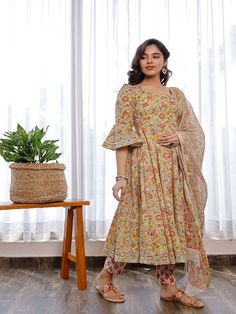 This gorgeous suit set, which includes pants and a chanderi hand block printed chanderi dupatta, is a must-have in your summer wardrobe. It has a flowery round neck hand block printed Anarkali with flared sleeves embellished with Gota. Neck: Boat Neck Sleeve Length: 3/4th Flared Sleeves Kurta Length: Claf Length Fabric: Kurta & Bottom - Cotton Dupatta -Chanderi Note: Wash Care Instructions - Dry Clean Only. The product will be shipped within 15-20 days of the order placed Measurements: Size Bust Fitted Cotton Silk Dupatta With Floral Print, Floral Print Cotton Silk Dupatta, Fitted Floral Print Cotton Silk Dupatta, Anarkali Style Floral Cotton Silk Palazzo Set, Anarkali Palazzo Set In Floral Cotton Silk, Designer Cotton Kurta With Floral Print, Bollywood Cotton Silk Sets With Floral Print, Bollywood Style Floral Print Cotton Silk Sets, Chanderi Palazzo Set With Floral Print And Straight Kurta