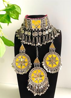 Full yellow Afghan jewellery set, Afghan Jewellery Vintage Kuchi Choker Necklace, Afghan Jewellery, Afghan Fashion  Set includes:  -oversized tikka -chocker necklace  -oversized earrings  Message for any enquiries Our Aim as a business is to connect Afghan women with their roots and to make anyone that purchases our jewellery feel powerful and beautiful as each and everyone of our items is handcrafted with care and love. Yellow Round Jewelry For Festivals, Bohemian Yellow Jewelry For Weddings, Yellow Bohemian Jewelry For Wedding, Yellow Bohemian Wedding Jewelry, Handmade Yellow Necklaces For Wedding, Handmade Gold Jewelry Sets For Festival, Adjustable Yellow Jewelry Sets For Gift, Yellow Metal Jewelry As Gift, Yellow Metal Jewelry Gift