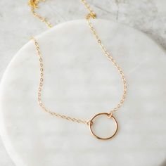 Beautiful 14k gold filled circle necklace that goes with everything. Perfect for everyday wear. Layer it with other gold necklaces or wear it alone. Details: Material: 14k gold filled Length: 16 inches Size: 13mm circle Gold Necklaces, Circle Necklace, Essie, Wear It, Gold Filled, Everyday Wear, Gold Necklace, Necklaces, Gold