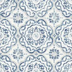 a blue and white tile pattern with an intricate design on the bottom half of it