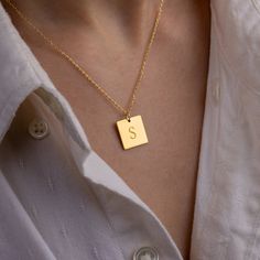 Stylish and minimalist 14K gold personalized square initial necklace for everyday wear. Great for layering.  Unique personalized gift idea to show love to the important people in your life with a cute, dainty, and creative gift. Customized rectangle tag necklace makes a perfect birthday gift for mothers, friends or yourself.  A special anniversary gift for significant others. Just engrave his/her name. It is a perfect gift. It can be dressed up or dressed down depending on the situation. We only Initials Charm Necklace With Square Pendant For Anniversary, Minimalist Yellow Gold Initial Necklace For Personalized Gift, Personalized Initials Necklace With Square Pendant, Anniversary Initials Square Pendant Charm Necklace, Personalized Yellow Gold Charm Necklaces With Square Pendant, Square Pendant Initial Necklace Gift, Anniversary Charm Necklace With Initials On Square Pendant, Square Pendant Necklace With Initials For Personalized Gift, Personalized Square Pendant Charm Necklaces In Yellow Gold