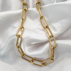 This fashion forward Paperclip Chain is a must have for every jewelry collection. It fits perfectly with any look and pairs with other jewelry for an ultra stylish look. | MATERIALS | - 18K Gold PVD Plated Stainless Steel | DETAILS | - 12mm Links - 20 inches - Waterproof | SHIPPING | All orders are sent via Canada Post. When checking out you may choose Untracked or Tracked Shipping.  Canada - Regular Shipping (NOT Tracked) 3-7 Business Days  - Expedited Shipping (Tracked)  2-6 Business Days Unit Gift Chain Link Necklace Tarnish Resistant, Tarnish Resistant Chain Link Necklace Gift, Tarnish Resistant Chain Necklace Gift, Tarnish-resistant Chain Link Necklace Gift, Paperclip Chain Necklace As A Gift, Modern Chunky Chain Necklace For Gift, Modern Chunky Chain Necklace As Gift, Trendy Link Chain Necklace Gift, Trendy Cable Chain Necklace As Gift