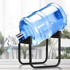 a water bottle is hooked up to a stand