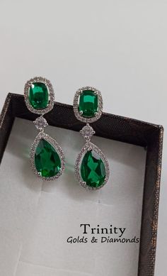 Emerald Dangle Earrings/ 14K Finish Emerald And Diamond Dangle Earring/ 925 Silver Diamond Dangle Earrings/ Wedding Bridal Earrings/ Gifts !~ Main Stone : Main Stone : Emerald Main Stone Creation: Lab created Diamonds Color :Green Cut:Pear/Oval !~ Secondary Stones Specifications : Moissanite Color - Near White or Cubic Zirconia - White > Stone Shape: Round Brilliant cut > Main Stone Clarity: VVS1 > Stone Color : Near White > Cut Grade: Excellent !~ Metal : > Metal Type: 100% 925 Sterling Silver Pear Shaped Emerald Earrings, Green Diamond Earrings For Formal Occasions, Green Diamond Drop Earrings, Fine Jewelry Green Drop Earrings, Green Fine Jewelry Drop Earrings, Emerald Drop Diamond Earrings For Wedding, Green Cubic Zirconia Earrings For Celebration, Wedding Drop Earrings With 17 Jewels, Elegant Green Teardrop Earring (single)