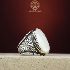 Stone Type: Mother of Pearl -Stone Dimensions: 1.8 cm x 2.5 cm -Metal Type: Sterling Silver(925k) & Bronze Details (Yellow Part) -Weight of the Item: 25 gr (Approx.) All items comes in a special gift box. If you don't see your size, please ask, we may produce your size. You are looking at the high quality handcrafted silver ring. All of our items have been designed and produced by ourselves ,so all our items comes with 1 year warranty as well. Thick Ring, Ring Elegant, Pearl Stone, Ring For Men, Silver Shop, Silver Rings Handmade, Elegant Ring, Pricing Jewelry, Men's Jewelry