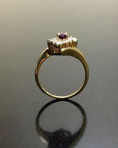 DeKara Designs Classic Metal- 14K Yellow Gold, .583 Stones- 1 Natural Marquise Ruby 0.30 Carats, 6 Baguette Diamonds, 8 Round Diamonds, F-G Color VS2 Clarity. Size- 4. FREE SIZING Art Deco Inspired Handmade Ruby Diamond Engagement Ring, Made in 14K Yellow Gold. The ring features a beautiful prong set marquise ruby. The marquise has three prong set baguette and four round diamonds that are also prong set on each side. This ring is a one of a kind and entirely handmade! FREE SHIPPING 7 Day Return Gold Amethyst Ring With Brilliant Cut Diamond, Diamond-encrusted Ruby Promise Ring, Diamond Ruby Promise Ring Hallmarked, Ruby And Diamond Marriage Ring, Promise Ruby Ring With Diamond Hallmarked, Gold Ruby Ring With Brilliant Round Cut, Diamond Amethyst Ring In Yellow Gold For Anniversary, Gold Ruby Ring With Halo Setting For Anniversary, Gold Amethyst Ring With Center Stone For Wedding