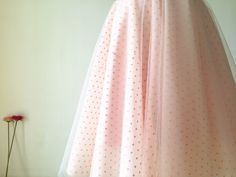 Custom Made(your own size, your preferred color, even your own design). Bridal satin waistband with hidden zipper Fully lined with bridal satin so it has the slip to protect your skin It is a polka dots tulle skirt with layers of blush pink tulle under it to give fullness We can dye the dots tulle into other colors upon request The listed skirt is mean to hit your knee but always able to custom make in different length The listed skirt is made in 23.5 inches/60CM For extra length, size enlargeme Spring Evening Lined Petticoat, Summer Wedding Midi Skirt, Feminine Tulle Skirt For Wedding, Full Skirt Pleated Petticoat For Wedding, Fitted Feminine Skirt For Wedding, Full Pleated Petticoat For Wedding, Feminine Fitted Skirt For Wedding, Fitted Wedding Petticoat With Pleated Skirt, Summer Wedding Petticoat With Flared Skirt