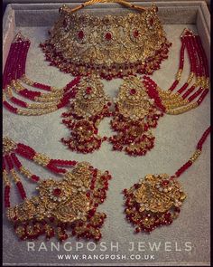 red and gold bridal jewelry in a box