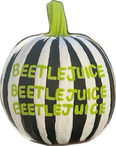 a black and white striped pumpkin with the words beetlejuice written in green on it