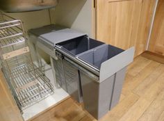 an empty dishwasher in the middle of a kitchen