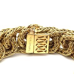 Estate Tiffany & Co. Vintage Braided Link Bracelet in 18K Yellow Gold. This rare bracelet features a hidden claps with a figure eight safety latch, is 7 3/8" long, 7/8" wide, and weighs 147.4 grams. Signed Tiffany & Co. 750 Italy and additional hallmarks. Tiffany Lock Gold Bracelet, Luxury Yellow Gold Chain Bracelet With Clasp, Luxury Chain Bracelet With Clasp For Formal Events, Luxury Chain Bracelet With Clasp For Formal Occasions, Luxury Gold Chain Bracelet With Clasp, Designer Gold Chain Bracelet For Formal Events, Designer Yellow Gold Chain Bracelet For Formal Occasions, Location Gifts, Tiffany & Co.