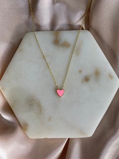 This heart necklace is so dainty and gorgeous, perfect for everyday wear! Information: 💖 The necklace is made of Sterling Silver, plated with 14K Gold. 💖 The pink color in the heart is made of enamel. 💖 The chain is a cable chain, adjustable to a total of 18 inches. 💖 Hypoallergenic 💖Water friendly This necklace makes a perfect gift and it's just right to layer with your other jewelry. Pink 14k Gold Necklace For Valentine's Day, Dainty Pink Heart Cut Necklaces, Dainty Pink Heart Cut Necklace, Pink Heart Pendant Charm Necklace For Anniversary, Tiny Charm Necklaces For Valentine's Day, Pink Gold Heart Pendant Necklace, Dainty Pink Heart Necklace For Valentine's Day, Delicate Heart Detail Necklace For Valentine's Day, Valentine's Day Pink Necklace With Delicate Chain