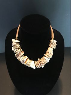 "Vintage Necklace Shell and Antler Natural Elements Design Gold Fill Primitive Beach Jewelry, 17 Inches This vintage necklace is a perfect accent to any summer outfit. It is largely made of natural elements and although large and impressive it also has an easy, beach life look. The 17 Inch necklace is centered with over 8 Inches of coin shells and antler which are center drilled and strung intermittently. The middle section is joined to two rope braids on both sides which connect securely with a Rope Braids, Character Symbols, Beach Jewelry, Cluster Ring, Purple Gold, Gemstone Bracelets, Geometric Designs, Antlers, Purple Amethyst