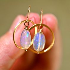 Golden Hoop earrings matched with two gorgeous opals that are a blue hue with a rainbow flash inside. These really bring a fun look to any outfit. Golden Hoops - Gold Vermeil (over .925 sterling silver) Ethiopian Opals - 14 x 9 mm 14 K Gold Filled Ear Wire Length: 1 1/4” Golden Hoop Earrings, Opal Drop Earrings, Golden Hoops, Hoops Gold, Blue Hues, A Rainbow, Ear Wire, Cute Jewelry, Ethiopian Opal