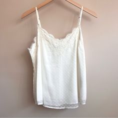 Never Worn Before - Bought Too Big. Will Fit A Medium Or A Larger Small Beautifully. A Stunning Basic To Keep In Your Collection To Dress Up Or Down. I’m Happy To Make A Separate Listing For You With A Temporarily Higher Price And Then Drop It To This Listing’s Price So You Get $4.99 Closet Clear Out Shipping! Just Comment On This Listing And I Will Set It Up For You. Comes From A Smoke-Free And Pet-Free Home. Feel Free To Check Out My Other Listings! Sign Up For Poshmark With My Code Athenasapp Chic White Camisole With Delicate Lace, White Feminine Tank Top With Delicate Lace, White Lace Camisole For Spring, Feminine White Lace Tank Top, White Delicate Lace Camisole For Spring, White Delicate Lace Cami Top, Feminine White Camisole With Lace Top, Feminine White Lace Camisole, Feminine White Lace Top Camisole