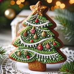 a decorated christmas tree cookie on a doily