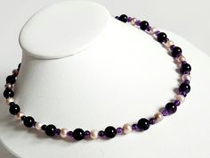 This beautiful necklace features round Amethyst beads in two sizes and 100% natural Lavender coloured Freshwater Pearls. The beads and Pearls are threaded on nylon coated 7 strand stainless steel beading wire, it's finished off with a 925 Sterling SIlver Lobster clasp and a two inch extender chain. Adjustable Faceted Bead Pearl Necklace, Adjustable Pearl Necklace With Gemstone Beads, Adjustable Round Pearl Necklace With Gemstone Beads, Adjustable Beaded Purple Pearl Necklace, Adjustable Purple Beaded Pearl Necklace, Adjustable Single Strand Lavender Beaded Necklace, Adjustable Lavender Single Strand Beaded Necklace, Handmade Purple Pearl Necklace With Round Beads, Adjustable Purple Pearl Necklace With Round Beads