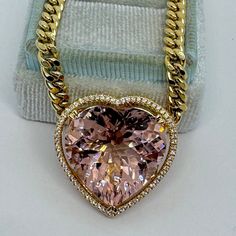 "Sweet Heart Morganite and Diamond Necklace Yellow Gold.  Custom design beautiful peachy pink morganite and diamond heart necklace.  The cut and color is so beautiful.  The diamonds are sparkling.  Nice size pendant, this is a collection piece.  Astriking conversation piece.  The heart halo measures 25mm. The heart morganite is about 20mm.  The chain can be worn at 18.75\", 17.75\", or 16.75\" lengths.  One only for a special lady!   Genuine Earth Mined Heart shape Morganite  22.45 Carats Clarity: VS Eye clean stone excellent cut and brilliance Genuine Round Brilliant cut diamonds  Total weight: 0.26 Carats  Clarity: SI Color: G 18K Yellow Gold 18.39 grams Comes with gift box GS6420" Diamond Star Earrings, Heart Halo, Diamond Cross Necklace Gold, Morganite Pendant, Diamond Heart Necklace, Mens Cross Necklace, Heart Necklace Diamond, Necklace Collection, Diamond Dangle Earrings