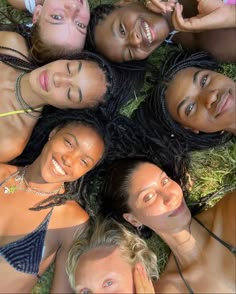 a group of young women laying on top of each other in the middle of a circle