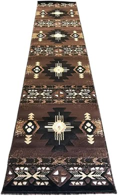 a brown and black area rug with an intricate design on the bottom, along with white background