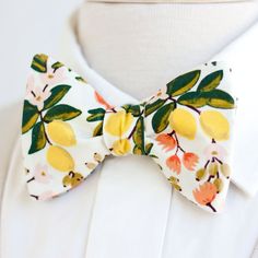 "Dapper Men's Citrus Floral In Cream Freestyle Self-Tie Bow Tie Made By The Belle And The Beau! ♥ This beautiful cotton floral fabric is part of our new Primavera Collection designed by Rifle Paper Co! We have been approved by Rifle Paper Co to make our products in these fabrics- that means we will be ordering bolts regularly! Yay! Our extraordinary, modern, and stylish freestyle self-tie bow ties are perfect for everyday, Sunday best, all special occasions, photography sessions, and especially White Bow Tie For Spring, Summer Dapper Bow Tie, White Dapper Bow Tie For Summer, Summer White Standard Bow Tie, Bowties Men's, Pre Tied Bow Tie, Boys Bow Ties, Wedding Order, Dapper Men