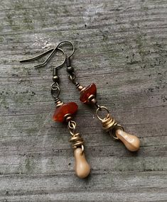 "Don't look now! Soon the seasons will be changing. The trees will shed their leaves as the earth goes into a season of rest.  With that in mind, these earrings were created with brown glass beads and copper pinecone charm. Each earring is  handmade to replicate one of my favorite seasons.  They are about 1.5\" in length and made with brass hardware. If you have any questions please feel free to message me anytime." Brown Czech Glass Beaded Drop Earrings, Brown Czech Glass Teardrop Earrings, Brown Wire Wrapped Drop Earrings, Brown Wire Wrapped Drop Beaded Earrings, Brown Czech Glass Dangle Earrings, Nickel Free Brown Earrings With Czech Glass, Nickel-free Brown Earrings With Czech Glass, Nickel-free Brown Czech Glass Earrings, Beaded Brown Czech Glass Earrings