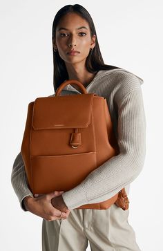 A chic and ultra-spacious office companion to refine your work-from-anywhere style. The Large Soft Backpack, handcrafted entirely from full-grain European leather, reimagines The Mini Soft Backpack with enhanced storage capability and increased all-day comfort. Featuring magnetic closure, a padded laptop sleeve to secure devices up to 16" and priority and zipped pockets to house valuables, the elegant carryall caters to every professional need. Crafted entirely from full grain sustainable DriTan Business Casual Backpack, Luxury Workwear Backpack With Detachable Strap, Luxury Backpack With Detachable Strap For Work, Luxury Leather Satchel Backpack For Work, Rectangular Work Backpack With Detachable Strap, Versatile Leather Backpack With Detachable Strap For Work, Rectangular Workwear Backpack With Detachable Strap, Classic Leather Backpack With Detachable Strap For Work, Elegant Backpack For Workwear