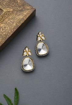 Classic, elegant & Effortless silver, gold, polki victorian earrings. Based in copper with rhodium plating and high grade glass polki. A perfect accessory for almost anything. It will go with everything and make your outfit super chic.These Earrings set have an excellent finish and gives out an exquisite sense of style. Perfect to wear to dinner, and perfect gift for family members, friends or bridesmaid. LENGTH Earrings Length - 3 cm Closure - Push Pin with a Clip DETAILS -100% top Quality Gold Dual-tone Earrings For Party, Gold Dual-tone Party Earrings, Kundan Drop Earrings For Formal Events, Formal Kundan Drop Earrings, Elegant Dual-tone Drop Earrings, Elegant Dual-tone Kundan Danglers, Silver Dual-tone Earrings For Party, Silver Danglers With Elegant Design For Festive Occasions, Elegant Dual-tone Danglers For Festive Occasions