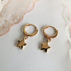 "✔️Star Hoop earrings made of 24K gold plated brass ✔️ This listing is for a pair of earrings - (2-star hoops) Modern & minimalist hoop earrings with a star-shaped charm. ✔️ So dainty and easy to put in ✔️ A very elegant and dainty pair of star charm earrings that upgrade your everyday look. These hoop earrings look beautiful layered with other gold earrings or even worn alone for a minimal look. They're tiny perfect for a child or for an adult. That's why they are considered your best choic Gold Star-shaped Hoop Earrings With Ear Wire, Gold Star Charm Hoop Earrings, Gold Hoop Earrings With Star Charm For Gift, Gold Hoop Earrings With Star Charm As A Gift, Gold Star-shaped Single Hoop Earring, Star-shaped Earrings With Lever Back For Gifts, Handmade Gold Star Hoop Earrings, Gold Plated Star Shaped Hoop Earrings, Gold Plated Star-shaped Hoop Earrings