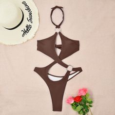 Indulge in allure with our Sultry Solid Hollow Out Monokini. This tantalizing one-piece swimsuit features intricate cut-out detailing that accentuates your curves in all the right places. Crafted from high-quality materials, it offers a perfect balance of comfort and sensuality, making it an ideal choice for poolside lounging or beach escapades. Embrace elegance and confidence as you make a splash in this statement-making swimsuitPattern: Solid colorWith Steel Bracket: With chest pad without ste Cutout Halter Neck Bodysuit For Swimming, Cutout Bodysuit For Beachwear, Beachwear Bodysuit With Halter Neck And Cutout, Beachwear Bodysuit With Cutout Halter Neck, Cutout Halter Neck Bodysuit For Pool, Halter Neck Cutout Bodysuit For Pool, Cutout Halter Neck Bodysuit For Beachwear, Cutout Backless Swimwear For Beach Season, Backless Cutout Swimwear For Beach Season